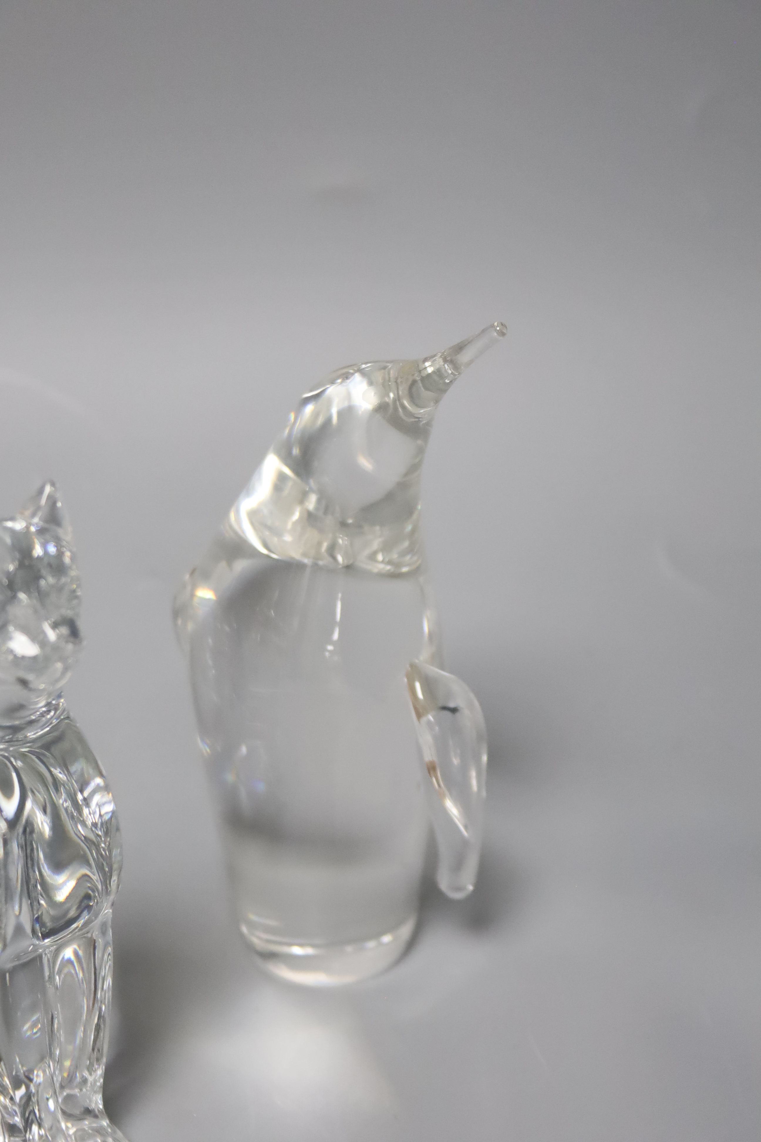 Three Steuben heavy moulded glass animals (penguin, frog and dolphin) and two other items,